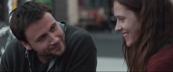 Movie still from “Berlin Syndrome” (2017), directed by Cate Shortland – A man and a woman sitting next to each other; Close Up shot, Over the shoulder angle