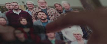 Movie still from “Berlin Syndrome” (2017), directed by Cate Shortland – A group of people standing in front of each other; Extreme Close Up shot, Over the shoulder angle