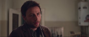 Movie still from “Berlin Syndrome” (2017), directed by Cate Shortland – A person wearing a jacket; Close Up shot, Over the shoulder angle