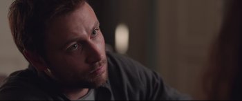 Movie still from “Berlin Syndrome” (2017), directed by Cate Shortland – A man's face in a dark room; Close Up shot, Over the shoulder angle