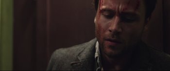 Movie still from “Berlin Syndrome” (2017), directed by Cate Shortland – A person with blood on his face; Close Up shot, Over the shoulder angle