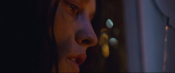 Movie still from “Berlin Syndrome” (2017), directed by Cate Shortland – A woman's face in the dark; Extreme Close Up shot, Low angle