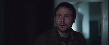 Movie still from “Berlin Syndrome” (2017), directed by Cate Shortland – A person looking up at the sky; Close Up shot, Over the shoulder angle