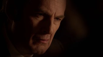 Movie still from “Better Call Saul” (2015), created by Vince Gilligan – A man's face in the dark; Close Up shot, Over the shoulder angle