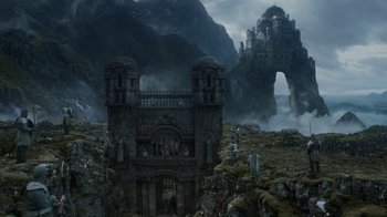 Movie still from “Game of Thrones” (2011), created by D.B. Weiss – An old castle is shown in the middle of a valley; Extreme Wide shot, Low angle