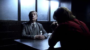 Movie still from “Better Call Saul” (2015), created by Vince Gilligan – A man and a woman sitting at a table in front of each other; Medium shot, Over the shoulder angle