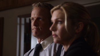 Movie still from “Better Call Saul” (2015), created by Vince Gilligan – A man and a woman are standing next to each other; Close Up shot, Low angle