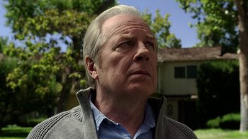 Movie still from “Better Call Saul” (2015), created by Vince Gilligan – An older man looking up at the sky with trees in the background; Close Up shot, Low angle