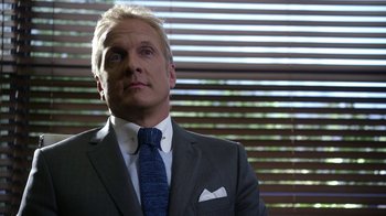 Movie still from “Better Call Saul” (2015), created by Vince Gilligan – A person wearing a suit and tie; Close Up shot, Low angle