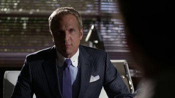 Movie still from “Better Call Saul” (2015), created by Vince Gilligan – A person wearing a suit and tie; Close Up shot, Over the shoulder angle