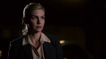 Movie still from “Better Call Saul” (2015), created by Vince Gilligan – A woman wearing a suit and a pink shirt; Close Up shot, Over the shoulder angle