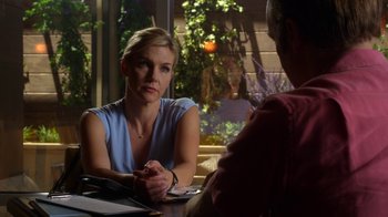 Movie still from “Better Call Saul” (2015), created by Vince Gilligan – A woman sitting in front of a man at a table in front of a window; Close Up shot, Over the shoulder angle