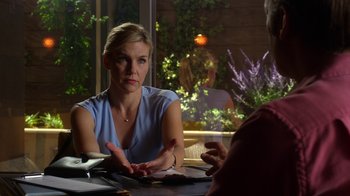 Movie still from “Better Call Saul” (2015), created by Vince Gilligan – A woman sitting at a table talking to another woman; Medium shot, Over the shoulder angle