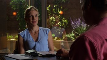 Movie still from “Better Call Saul” (2015), created by Vince Gilligan – A woman sitting at a table talking to a man; Medium shot, Over the shoulder angle