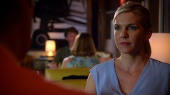 Movie still from “Better Call Saul” (2015), created by Vince Gilligan – A woman sitting at a table in front of a group of people; Close Up shot, Over the shoulder angle