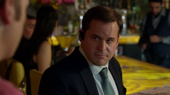 Movie still from “Better Call Saul” (2015), created by Vince Gilligan – A person wearing a suit and tie; Close Up shot, Over the shoulder angle