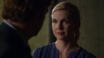 Movie still from “Better Call Saul” (2015), created by Vince Gilligan – A woman in a blue dress looking at a man in a blue shirt; Close Up shot, Over the shoulder angle