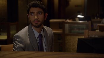 Movie still from “Better Call Saul” (2015), created by Vince Gilligan – A man sitting at a table in front of a laptop; Close Up shot, Over the shoulder angle