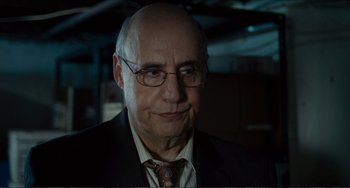 Movie still from “Win Win” (2011), directed by Tom McCarthy – An older man wearing a suit and tie; Close Up shot, Over the shoulder angle