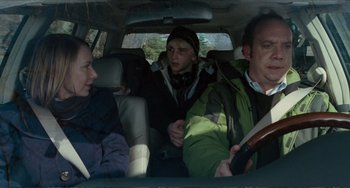 Movie still from “Win Win” (2011), directed by Tom McCarthy – A group of people sitting in the back of a car; Medium shot, Over the shoulder angle