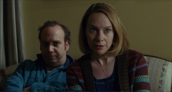 Movie still from “Win Win” (2011), directed by Tom McCarthy – A woman and a man sitting next to each other in a room; Close Up shot, Over the shoulder angle