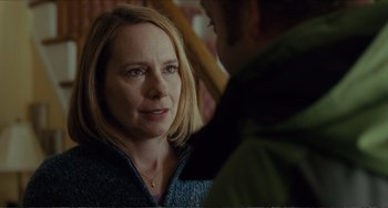 Movie still from “Win Win” (2011), directed by Tom McCarthy – A woman is looking at a man in a green jacket; Close Up shot, Over the shoulder angle