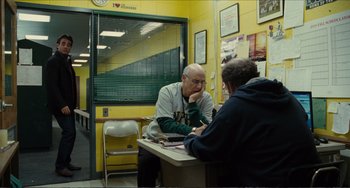 Movie still from “Win Win” (2011), directed by Tom McCarthy – A man sitting at a table talking to a woman; Wide shot, Over the shoulder angle