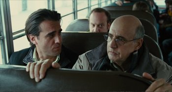 Movie still from “Win Win” (2011), directed by Tom McCarthy – Two men sitting on a bus looking at each other; Close Up shot, Over the shoulder angle