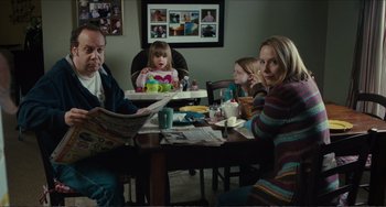 Movie still from “Win Win” (2011), directed by Tom McCarthy – A group of people sitting at a table with food; Medium shot, Over the shoulder angle