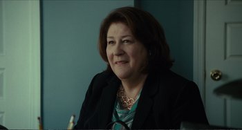 Movie still from “Win Win” (2011), directed by Tom McCarthy – A person sitting in a chair; Close Up shot, Over the shoulder angle