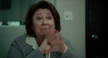 Movie still from “Win Win” (2011), directed by Tom McCarthy – An older woman is making a funny face with her hands; Close Up shot, Low angle