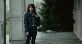 Movie still from “Win Win” (2011), directed by Tom McCarthy – A woman in a blue jacket holding a black purse; Medium shot, Over the shoulder angle