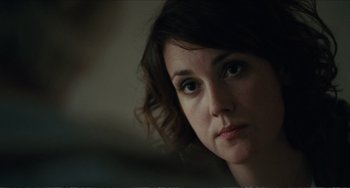 Movie still from “Win Win” (2011), directed by Tom McCarthy – A woman's face in a dark room; Close Up shot, Over the shoulder angle