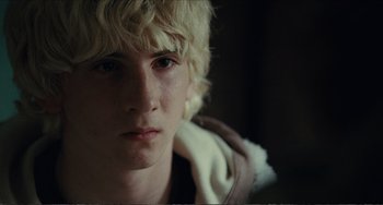 Movie still from “Win Win” (2011), directed by Tom McCarthy – A person holding a towel; Close Up shot, Over the shoulder angle