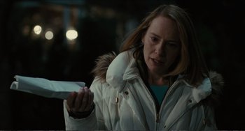 Movie still from “Win Win” (2011), directed by Tom McCarthy – A woman in a white jacket holding a knife; Close Up shot, Low angle