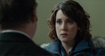 Movie still from “Win Win” (2011), directed by Tom McCarthy – A woman in a blue jacket looking at a man in a black jacket; Close Up shot, Over the shoulder angle