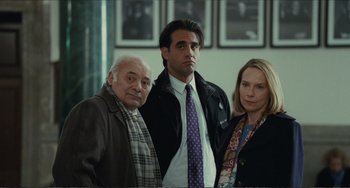 Movie still from “Win Win” (2011), directed by Tom McCarthy – A man and two women standing next to each other; Medium shot, Over the shoulder angle
