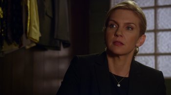 Movie still from “Better Call Saul” (2015), created by Vince Gilligan – A woman in a black jacket looking at the camera; Close Up shot, Over the shoulder angle