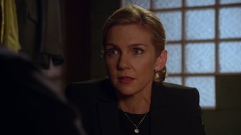 Movie still from “Better Call Saul” (2015), created by Vince Gilligan – A person wearing a suit; Close Up shot, Over the shoulder angle