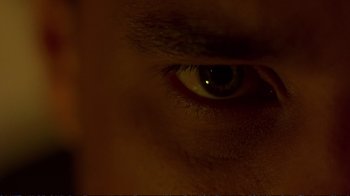 Movie still from “2 Fast 2 Furious” (2003), directed by John Singleton – A man's eye with a light shining on it; Extreme Close Up shot, Overhead angle