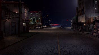 Movie still from “2 Fast 2 Furious” (2003), directed by John Singleton – An empty street at night with a red light; Extreme Wide shot, High angle
