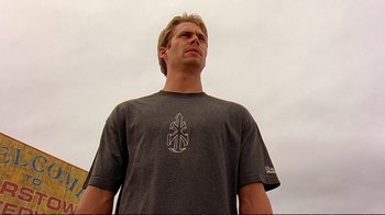 Movie still from “2 Fast 2 Furious” (2003), directed by John Singleton – A man in a gray shirt is looking upward; Close Up shot, Low angle