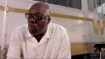 Movie still from “2 Fast 2 Furious” (2003), directed by John Singleton – A man in a white shirt and black glasses; Close Up shot, Low angle