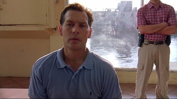 Movie still from “2 Fast 2 Furious” (2003), directed by John Singleton – A person in front of a window; Medium shot, Low angle