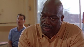 Movie still from “2 Fast 2 Furious” (2003), directed by John Singleton – A man with a bald head and a goatee looking at the camera; Close Up shot, Low angle