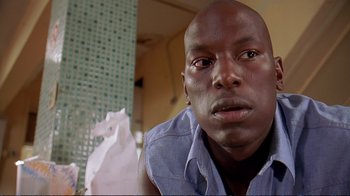 Movie still from “2 Fast 2 Furious” (2003), directed by John Singleton – A person holding a piece of paper; Close Up shot, Low angle