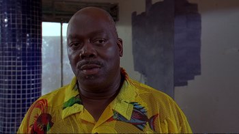 Movie still from “2 Fast 2 Furious” (2003), directed by John Singleton – A person wearing a yellow shirt; Close Up shot, Low angle