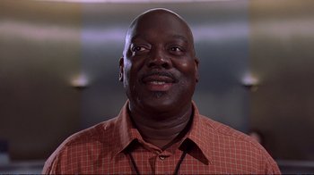 Movie still from “2 Fast 2 Furious” (2003), directed by John Singleton – A person wearing a red and white shirt; Close Up shot, Low angle