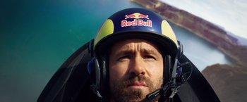 Movie still from “6 Underground” (2019), directed by Michael Bay – A person wearing a red bull helmet; Close Up shot, Low angle