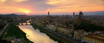Movie still from “6 Underground” (2019), directed by Michael Bay – A view of a city from a bridge at sunset; Extreme Wide shot, High angle